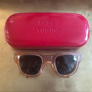 Acne sunglasses with case.